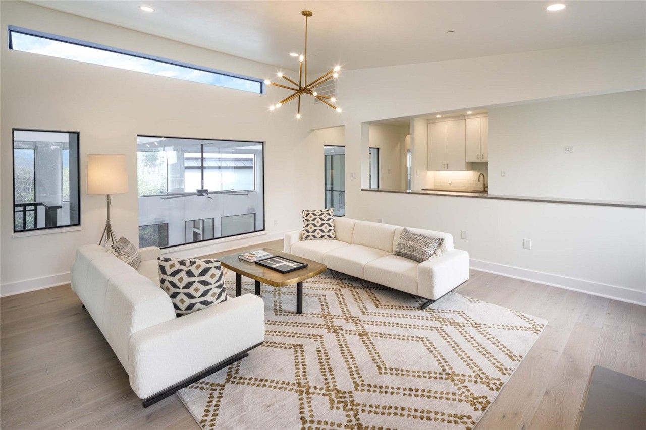 Upstairs living area with open sightline to adjacent spaces