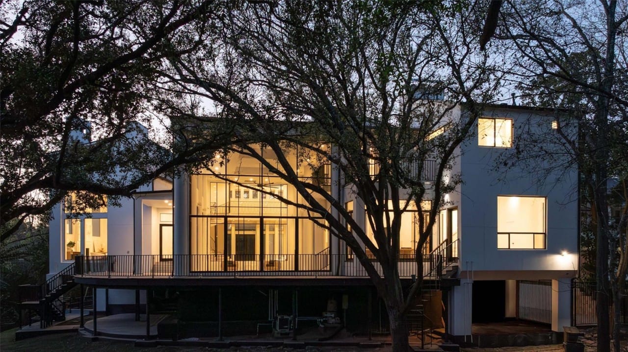 Rear exterior of 10663 Memorial Drive at dusk