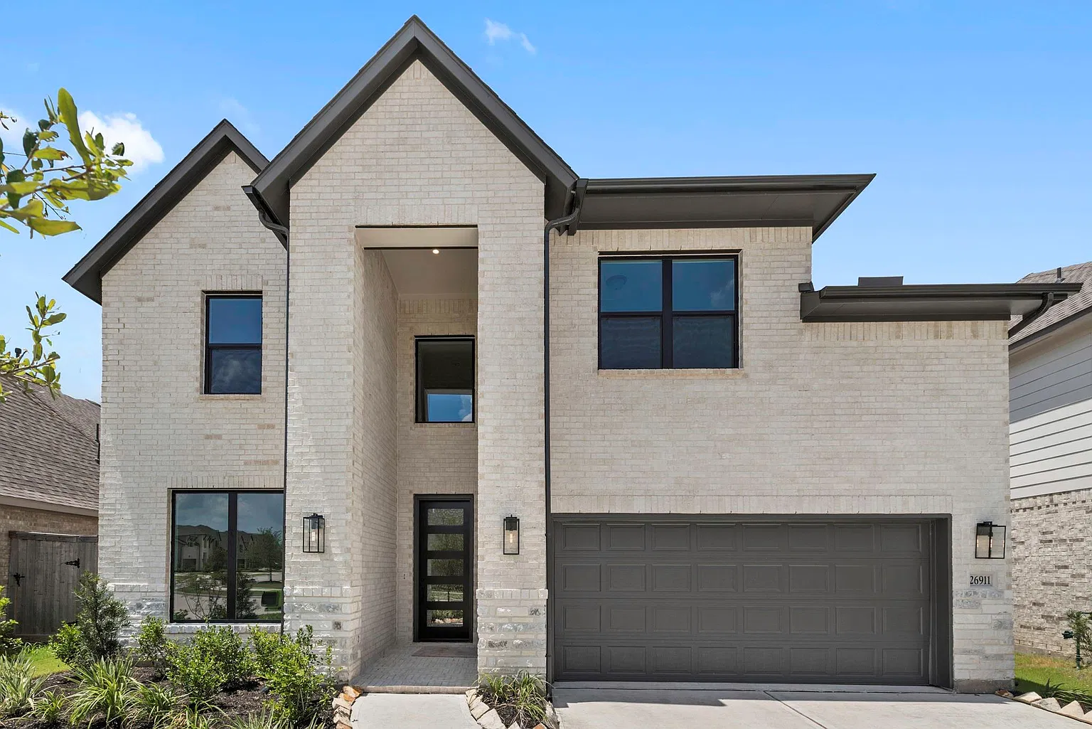 Front exterior of 26911 Steradian Lake Ln with attached two-car garage | 26911 Steradian Lake Ln正面及双车位车库