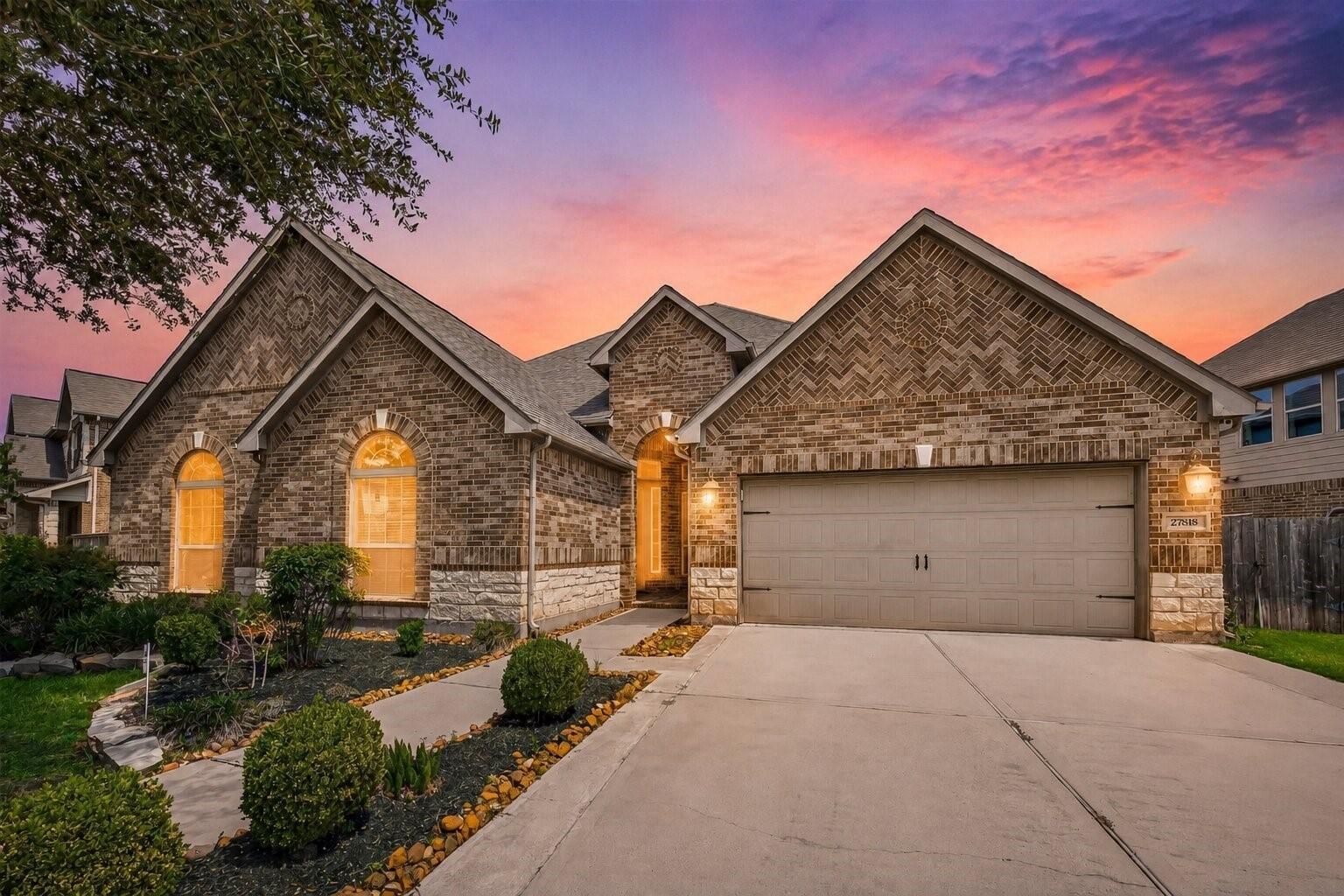 Twilight front exterior of 27818 Tamara Branch Lane in Cinco Ranch