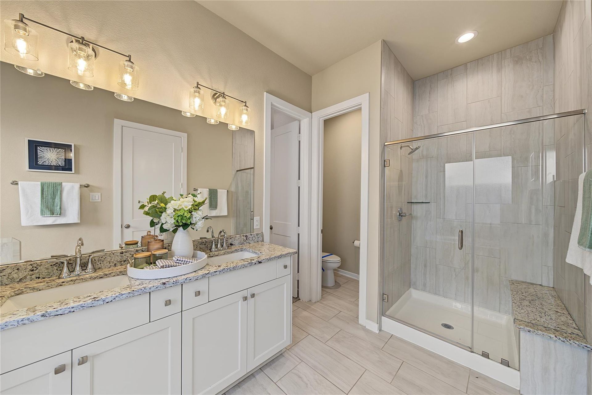 Primary bathroom with double vanity and glass shower | 主卫双洗手台与玻璃淋浴间