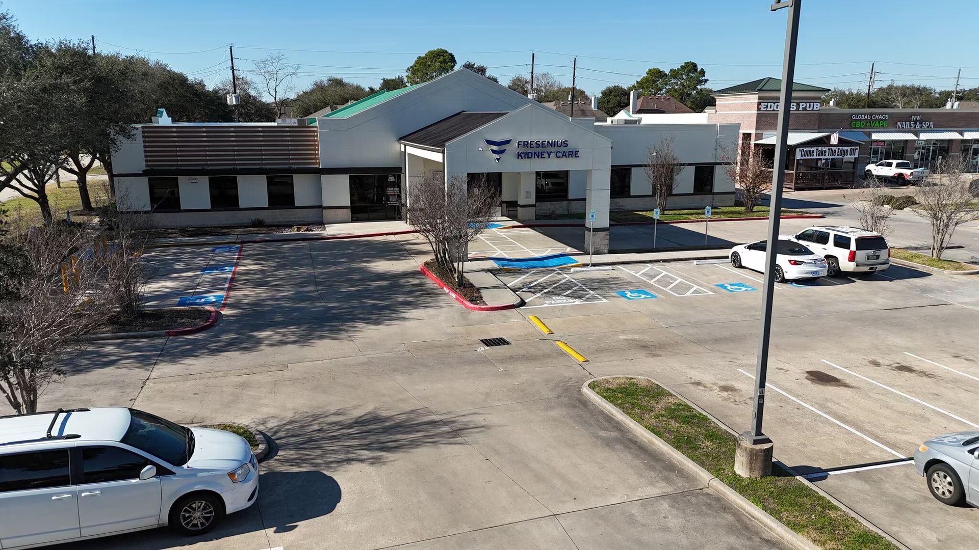 Medical office building storefronts and surface parking at 8925 N Highway 6