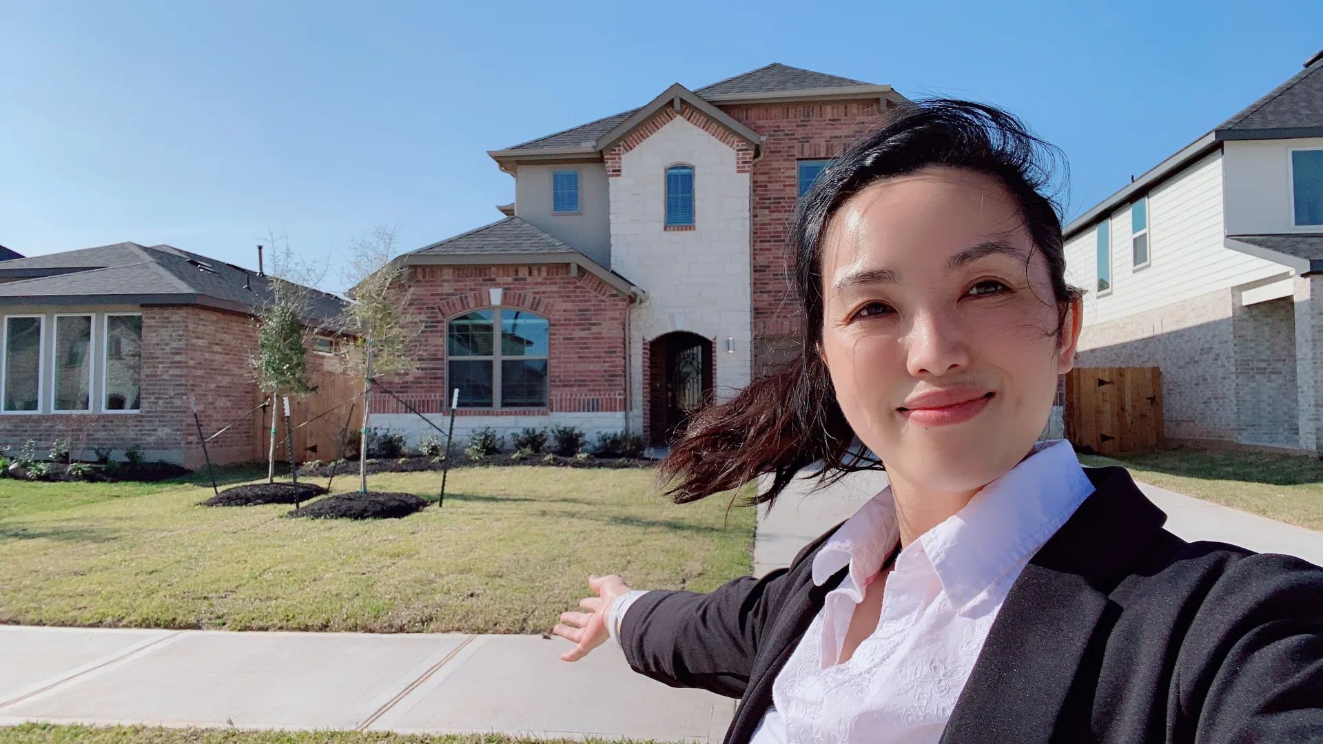 Joyce Tang presenting a Greater Houston home during an on-site property tour